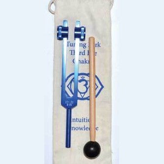 Tuning fork and mallet with a white pouch featuring symbols and text on a white background