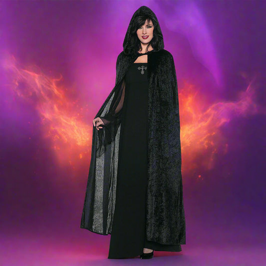 Woman wearing a black costume with a hood on a white background