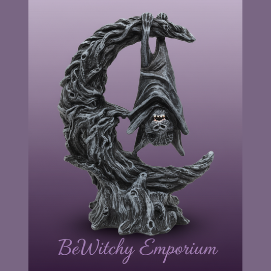 Exact bat hanging on crescent moon statue with clean professional styling and BeWitchy Emporium watermark