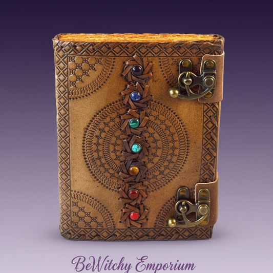 Exact brown leather chakra journal with spiral design with clean professional styling and BeWitchy Emporium watermark