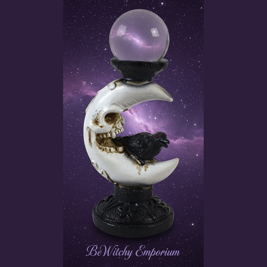 Exact skull and raven crystal ball holder with cosmic mystical styling and BeWitchy Emporium watermark